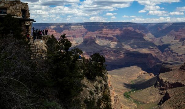 Tourists look out from the South Rim at the Grand Canyon on Thursday, May 4, 2023. The Havasupai Tribe held a blessing ceremony to mark the renaming of a popular campground from Indian Garden to Havasupai Gardens. (AP Photo/Ty O'Neil)