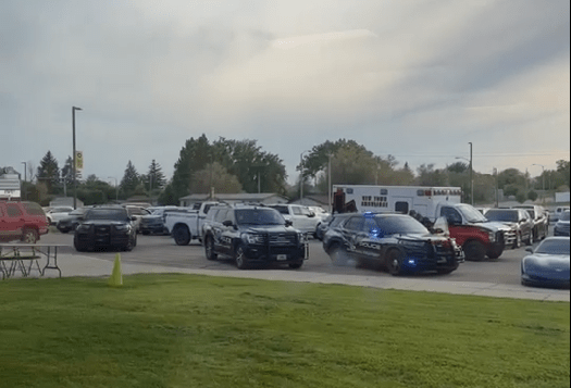Police cars on the scene at the Mountrail-Williams Electric Cooperative annual meeting in New Town, N.D. after  threats of violence were made against American Indians. 