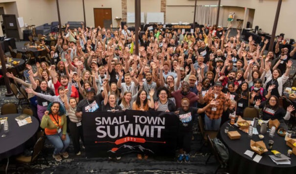 Participants pose together for a photo at the Holiday Inn during the first Small Town Summits last day in Missoula, Mont. on Wednesday June 7th, 2023. (Photo by Andrew Kemmis)