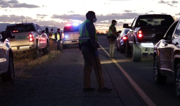 The Navajo Police Department has been holding checkpoints to share information about the curfew order on the Navajo Nation. (Courtesy of Farmington Daily Times/Noel Lyn Smith)