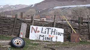 A sign opposing the proposed Thacker Pass lithium mine is displayed on Elwood Hinkey's property on the Fort McDermitt Indian Reservation in Nevada on March 11, 2022. Hinkey made the sign for his granddaughter to take to a protest camp. (Photo by Alex Milan Tracy for Underscore)