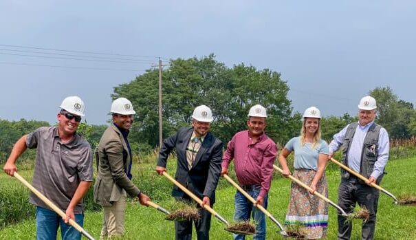 Iowa Tribe of Kansas and Nebraska leaders and others break ground on July 17, 2023, at the site of a future free trade zone that the tribe is building near its northeastern Kansas reservation. From left to right: Brandon Roberts, tribal member and deputy general manager of Grey Snow Construction Services; Benson Saulo, Australian consul-general and trade and investment commissioner; tribal Chairman Timothy Rhodd; tribal Secretary Tony Fee; tribal member Cheyenne Colborn; and tribal Vice-Chairman Lance Foster. (Courtesy of Iowa Tribe)