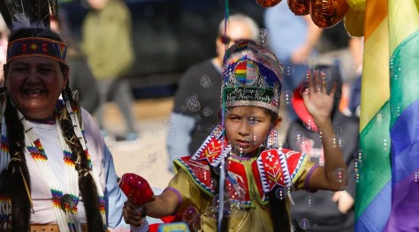Eight-year-old Kamiliah Stewart represented the Two-Spirit community from a parade float Saturday during the Native American Day Parade. (Photo by Darsha Dodge, Rapid City Journal)
