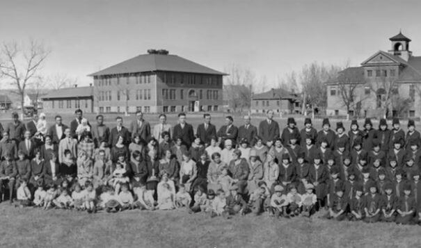Kibbe Brown's aunt who attended the Rapid City Indian School had saved a panoramic photo of students and staff from between 1925-27, with the school's campus in the background. (Photo courtesy of Remembering the Children)