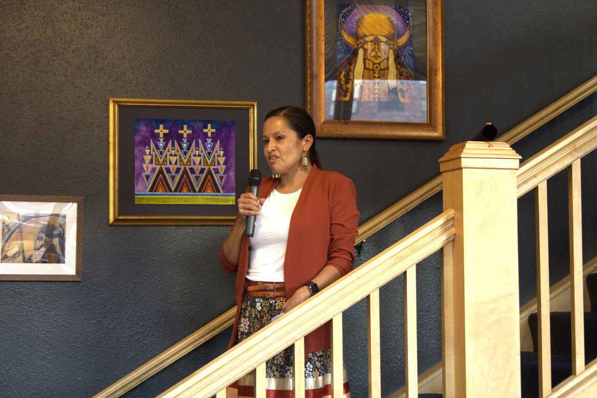 Amy Sazue, executive director of Remembering the Children spoke on Sept. 30 during the grand opening of the exhibit in Tusweca Gallery in Rapid City. (Photo by Amelia Schafer, ICT/Rapid City Journal)