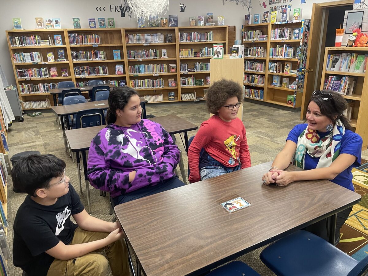 Dawn Quigley visited several schools, including Grimsrud Elementary where she talked with fourth and fifth grade students like Kently Many Horses, Kyrie Provost and Stefan Burton about the meaning behind her books on Oct. 26. Photo credit/ Adrianna Adame