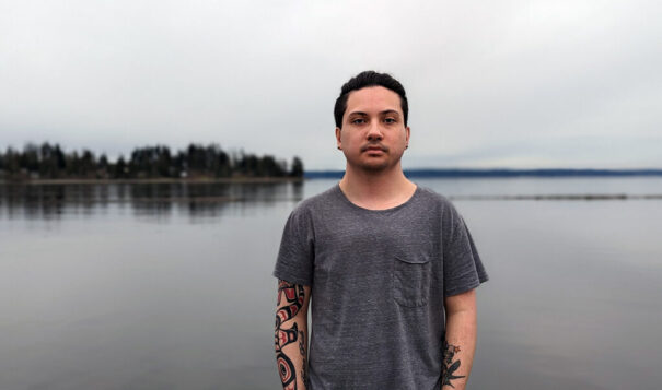 Andres “Dre” Thornock, 23 stands in front of the Tulalip Marina. Thornock spent 15 years in the Tulalip Tribes' foster care system. (Nancy Marie Spears, The Imprint)