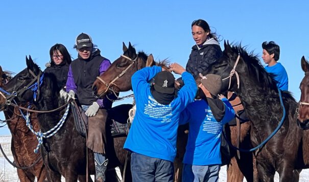 On a stop between Wounded Knee, S.D. and Pine Ridge, S.D, Oomaka Tokatakiya, Future Generations Riders make the final leg of a 300-mile journey on Dec. 29. The ride commemorates  the Wounded Knee Massacre of Dec. 29, 1890. Photo Credit/Jodi Rave Spotted Bear