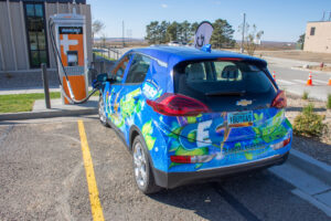  Capital Electric Cooperative’s EV, nicknamed “Elektra” Chevy Bolt, was purchased by the co-op in order to help members better understand the technology. Here “Elektra” charges outside the offices of the North Dakota Association of Rural Electric Cooperatives in Mandan. Photo provided by NDAREC. 