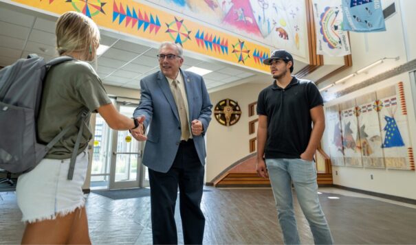 South Dakota State University President Barry Dunn, Rosebud Sioux, confers with two students in the popular SDSU American Indian Student Center, which opened in 2020. (Photo courtesy SDSU)