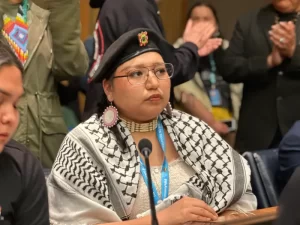 Morgan Brings Plenty, Cheyenne River Sioux, gives an intervention about lawsuits targeting protesters during the NoDALP movement at the United Nations Permanent Forum on Indigenous Issues at the UN headquarters in New York City on April 16, 2024. (Pauly Denetclaw, ICT)